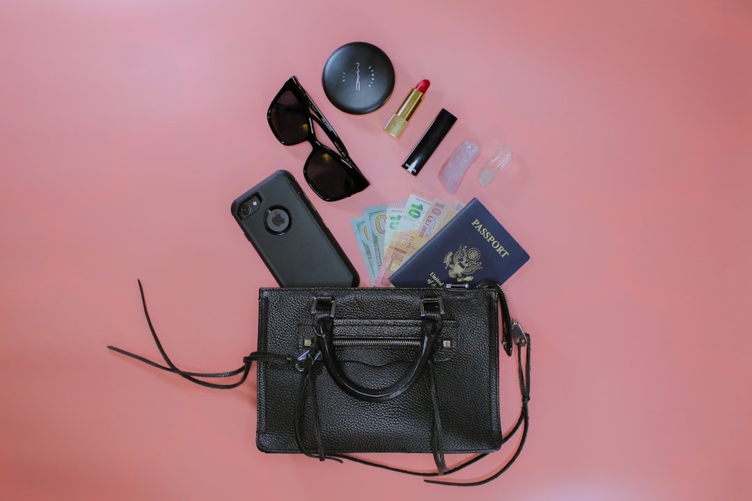 Small travel capsule wardrobe arranged beside a suitcase